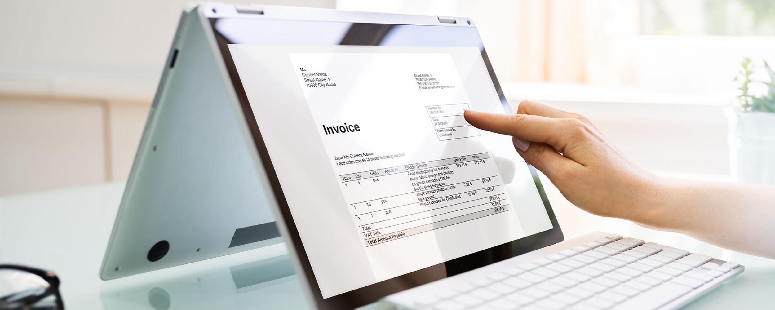 Electronic invoice is displayed on laptop